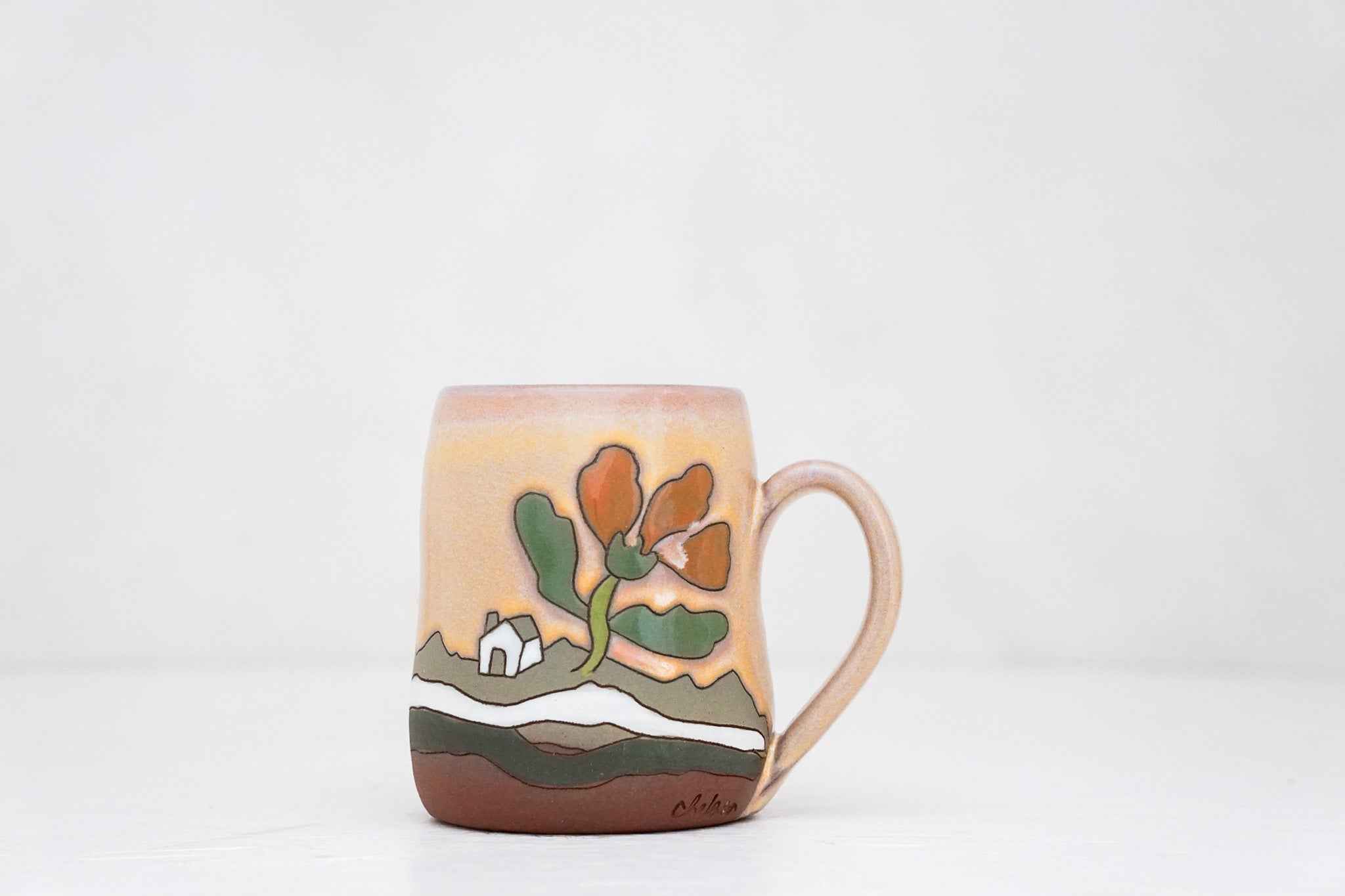 Wavy Cabin in the Flowers mug in Alpenglow*