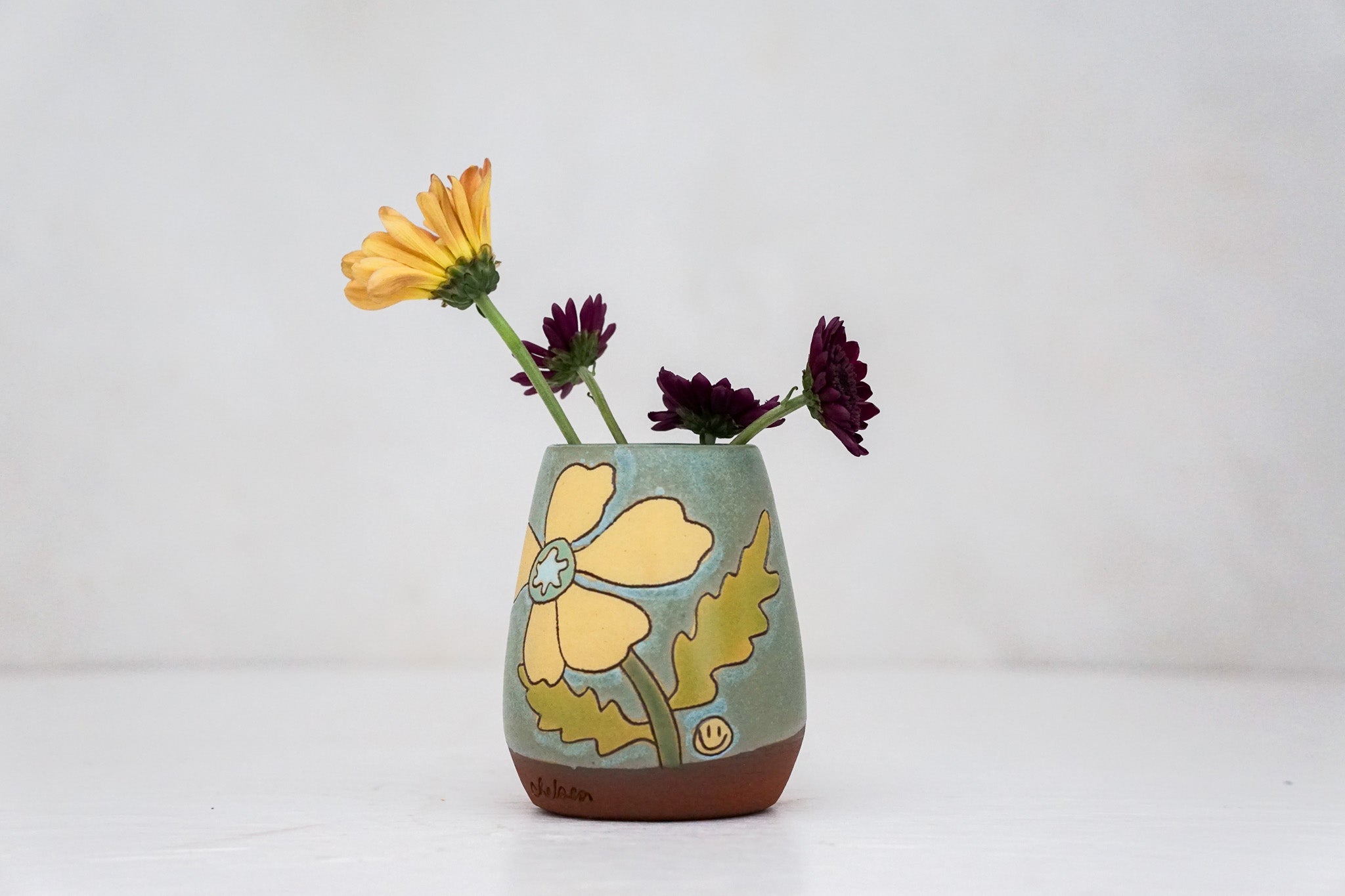 Yellow Flower vase in Lake