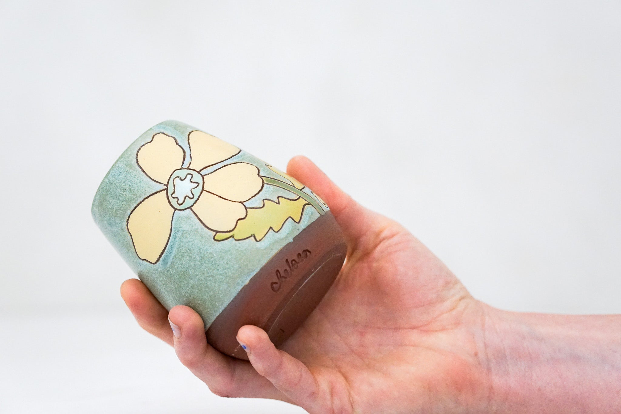 Yellow Flower vase in Lake