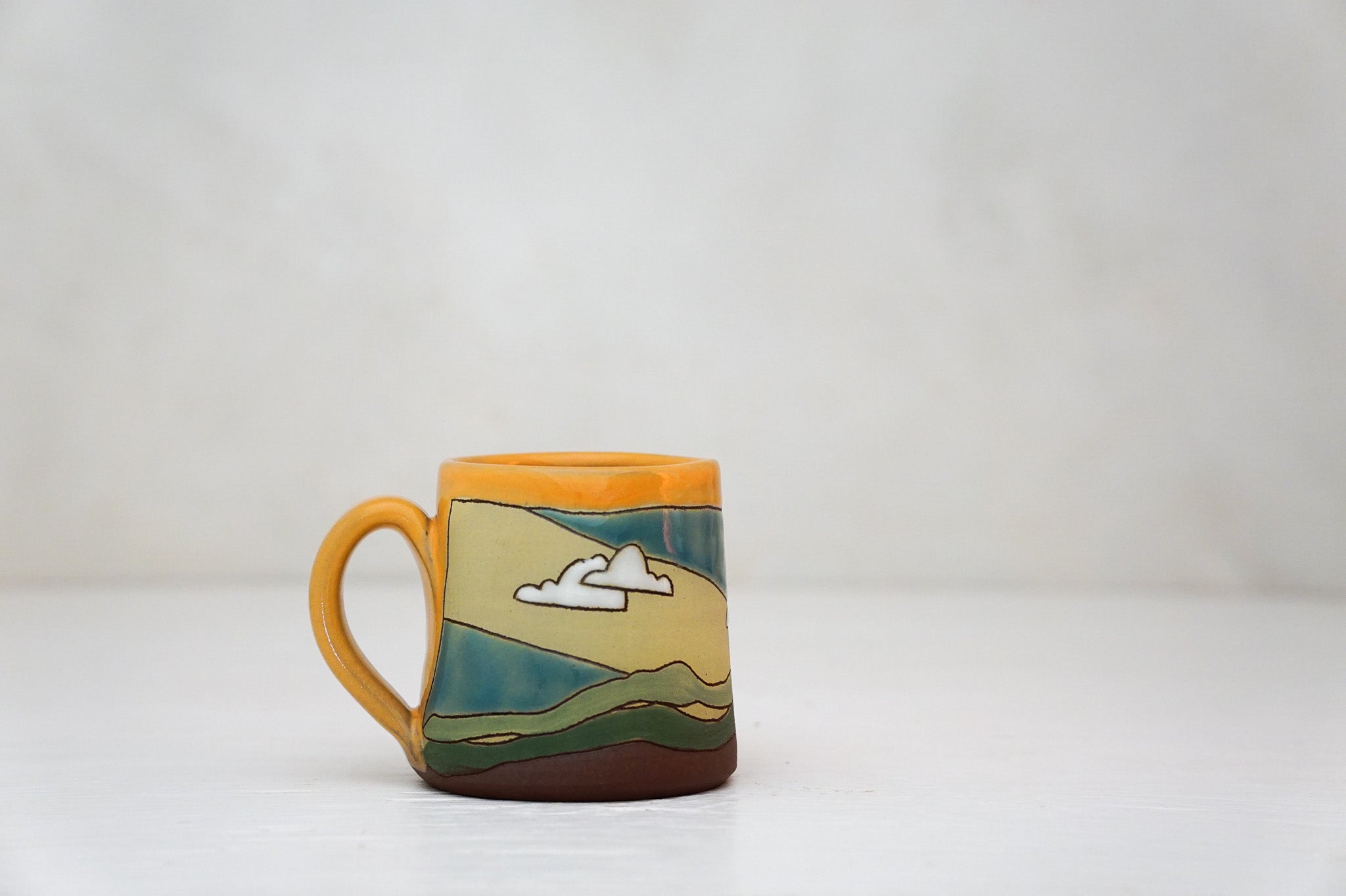 Sunburst Tiny mug in TangX