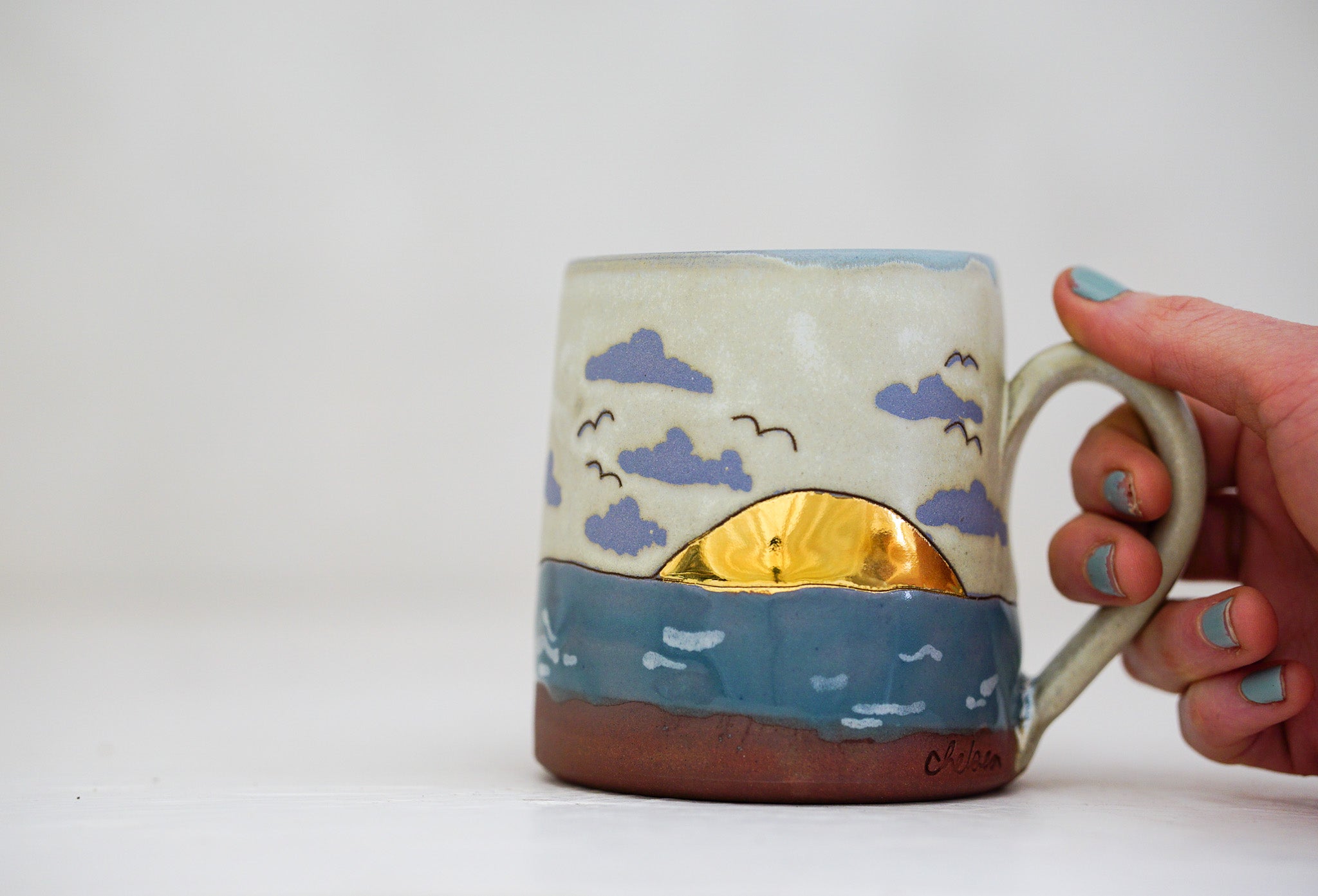 Waves roll in mug in Bone