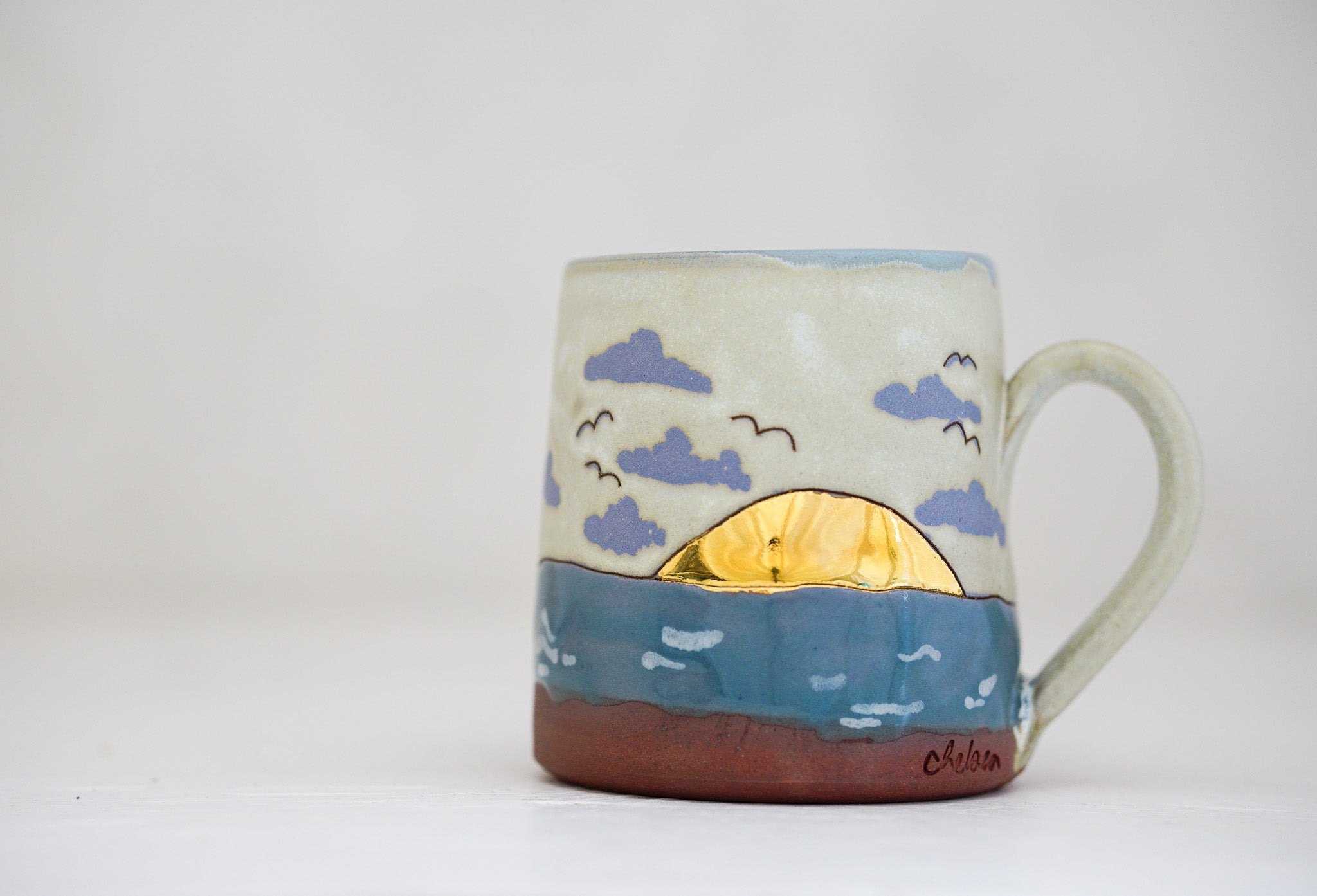 Waves roll in mug in Bone