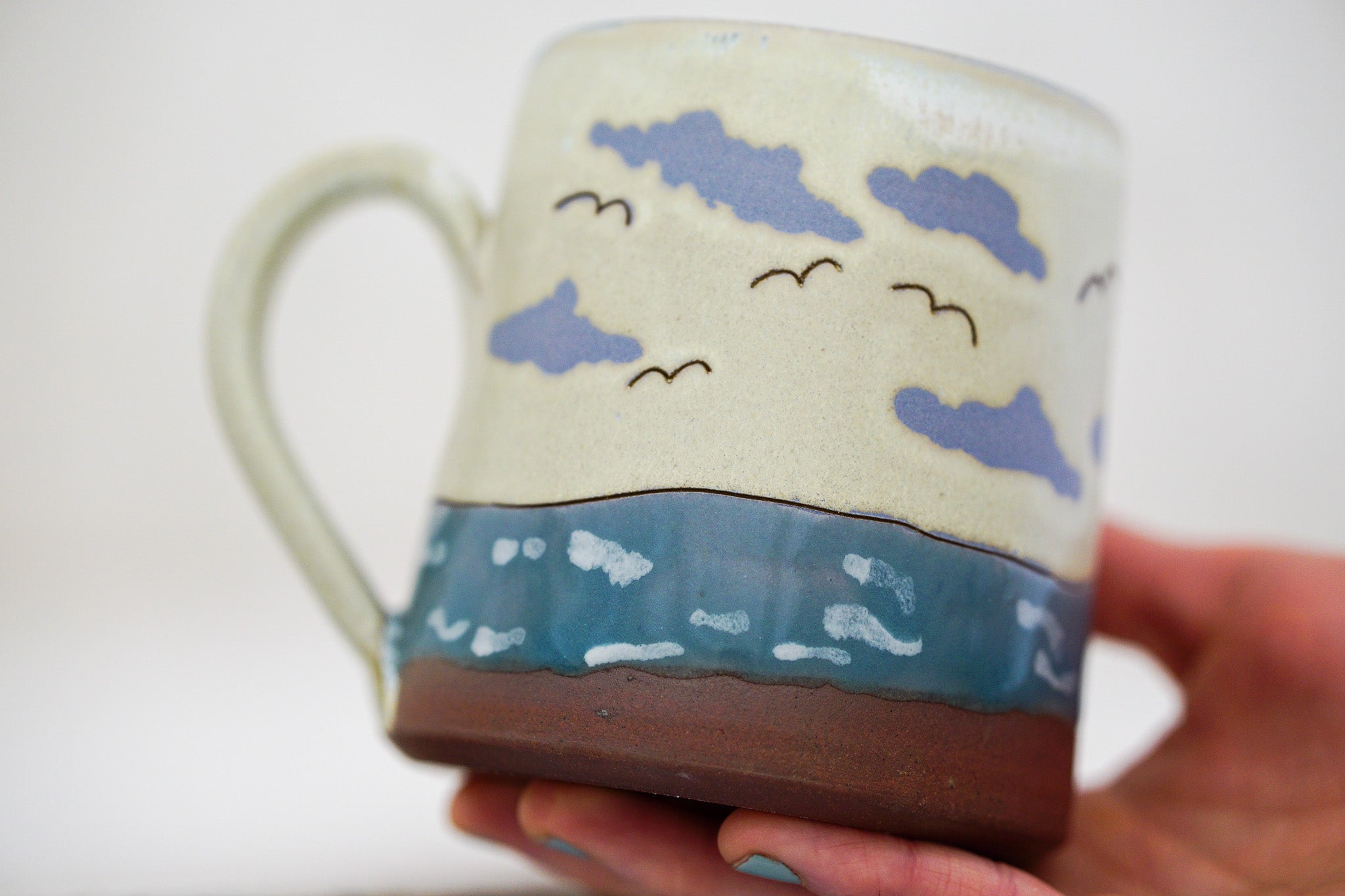 Waves roll in mug in Bone
