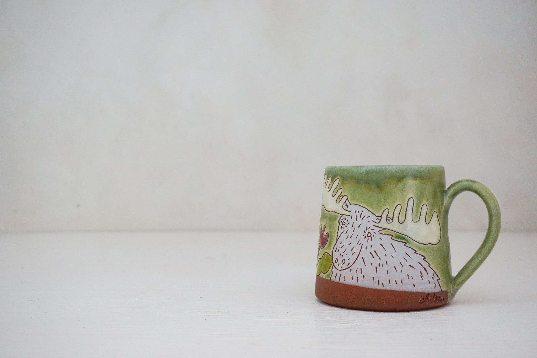 Moose smelling Flowers mug in Sage