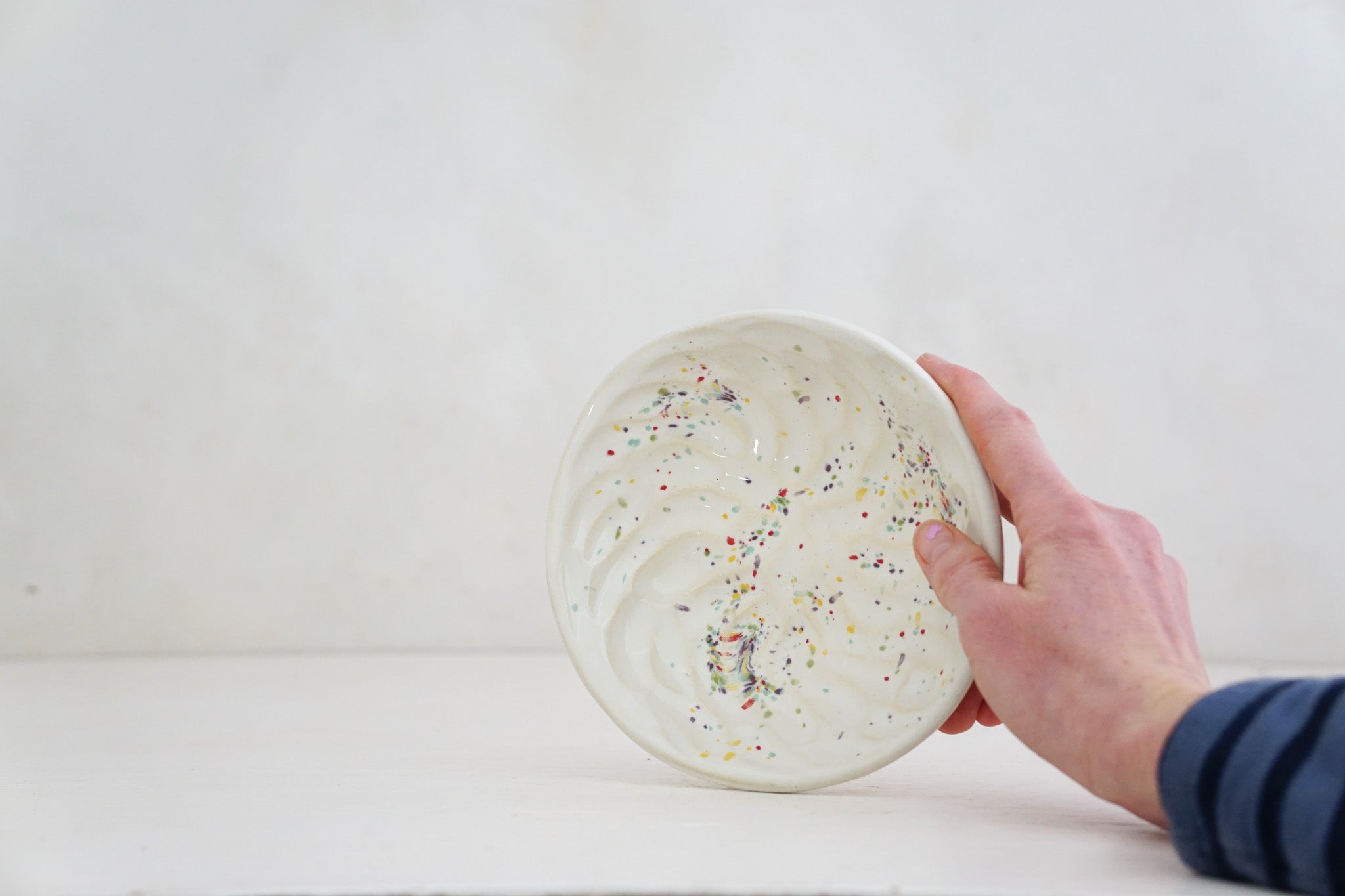 Handbuilt Thumbprint bowl in rainbow speck 2