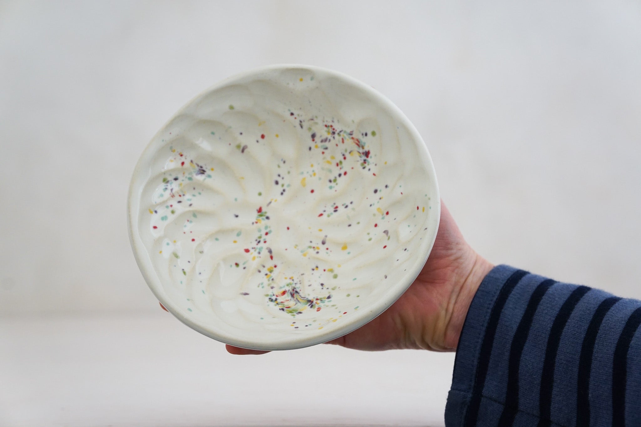 Handbuilt Thumbprint bowl in rainbow speck 2