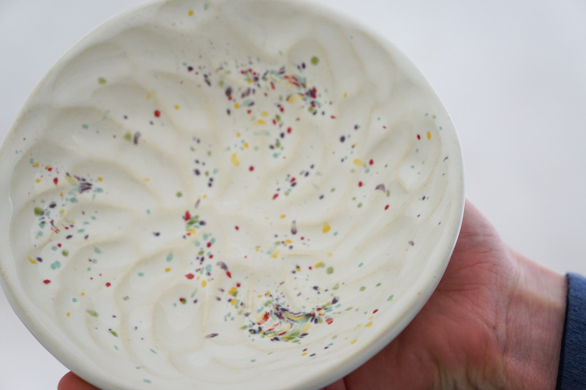 Handbuilt Thumbprint bowl in rainbow speck 2