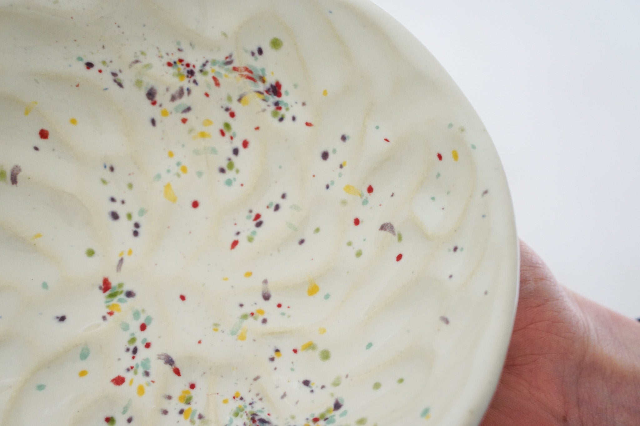 Handbuilt Thumbprint bowl in rainbow speck 2