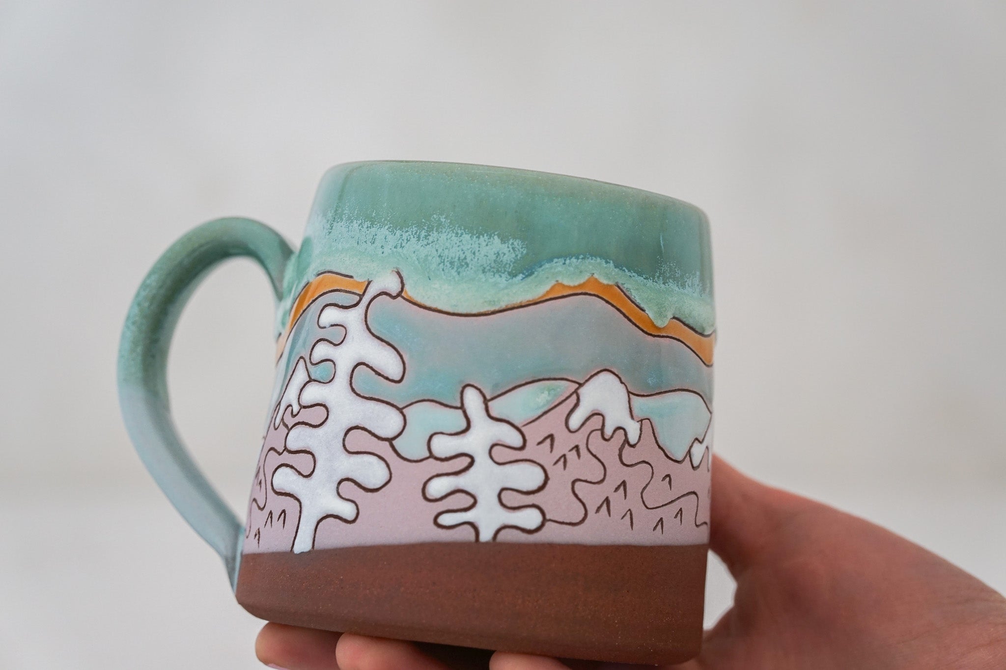 Mtn tree Skylines mug in Ira Blue*