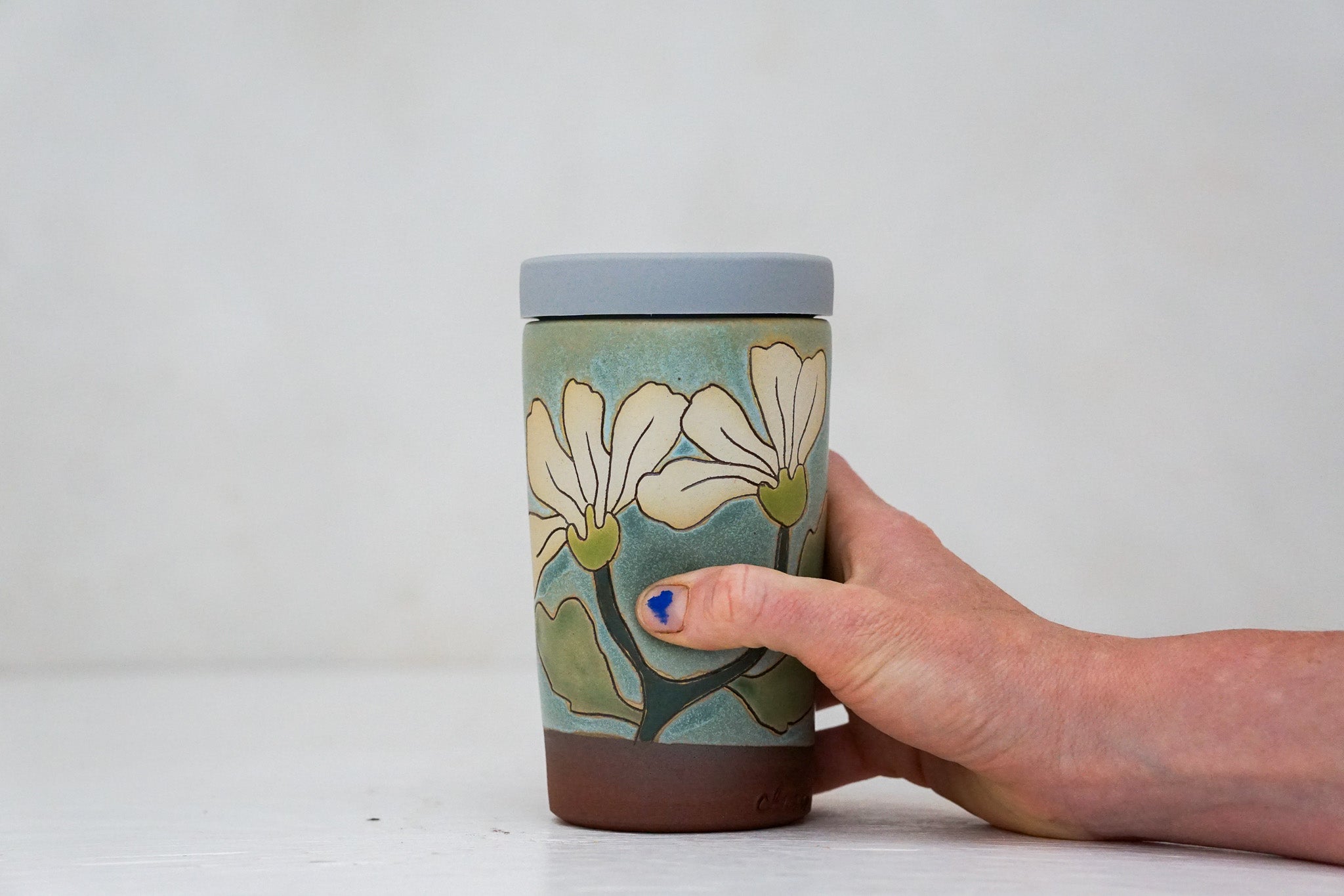 Flowers have poweres travel cup in Lake