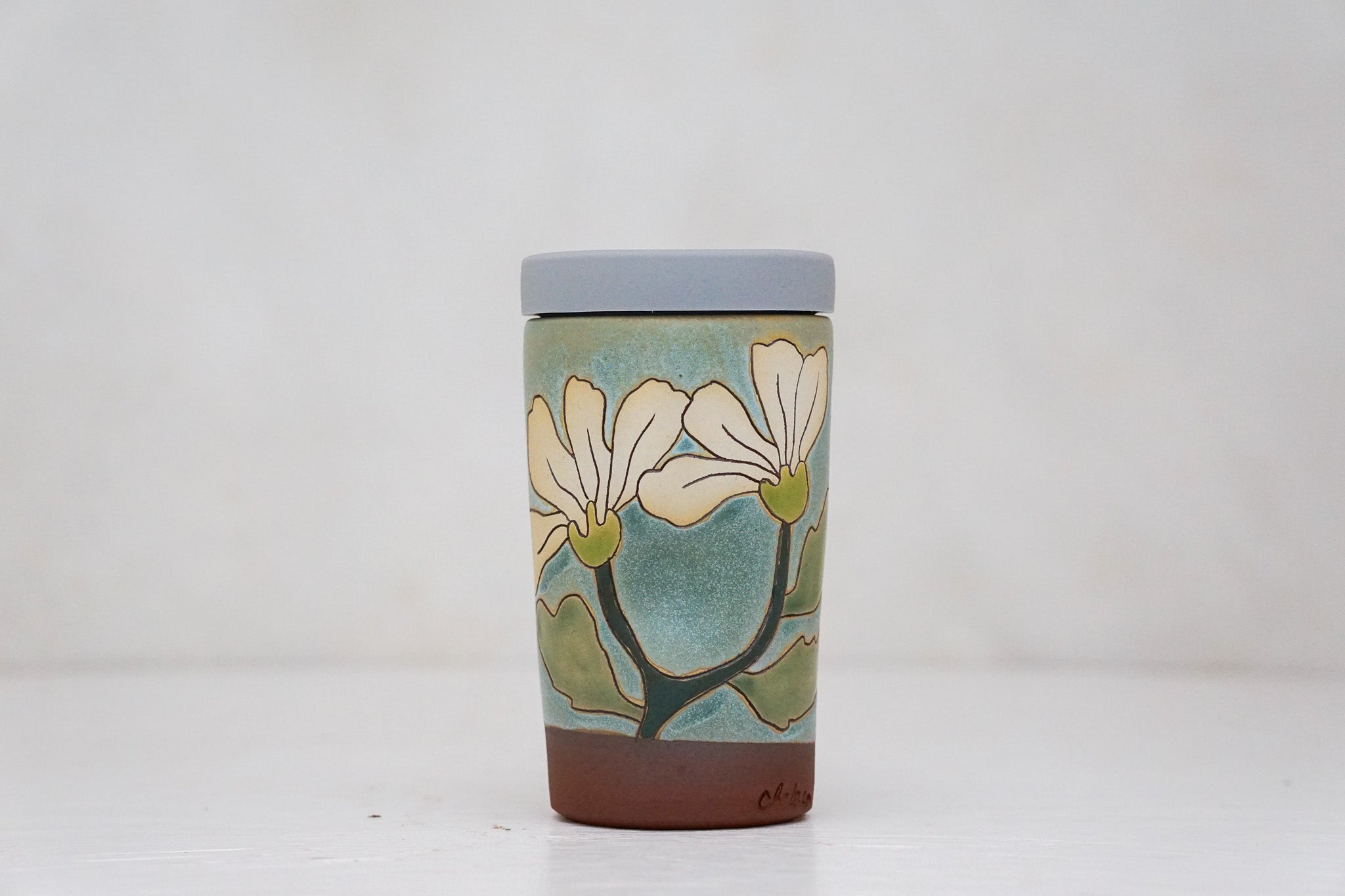 Flowers have poweres travel cup in Lake
