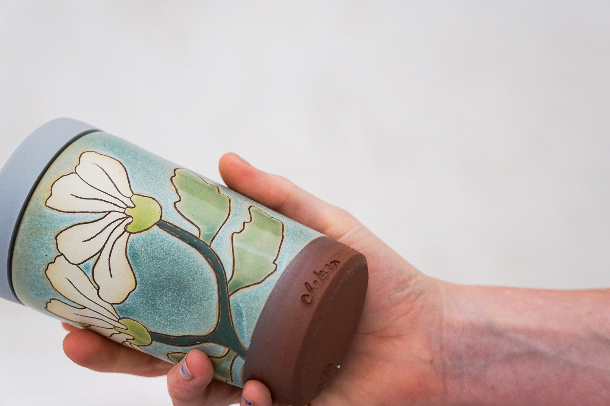 Flowers have poweres travel cup in Lake