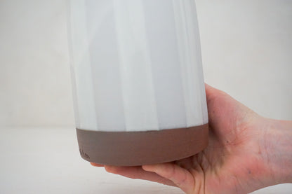 Glossy white glaze stripes on flat white slip Tall jar image 1