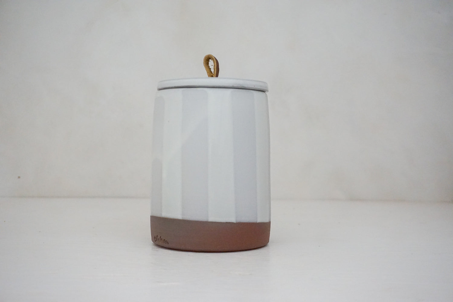Glossy white glaze stripes on flat white slip Tall jar image 5