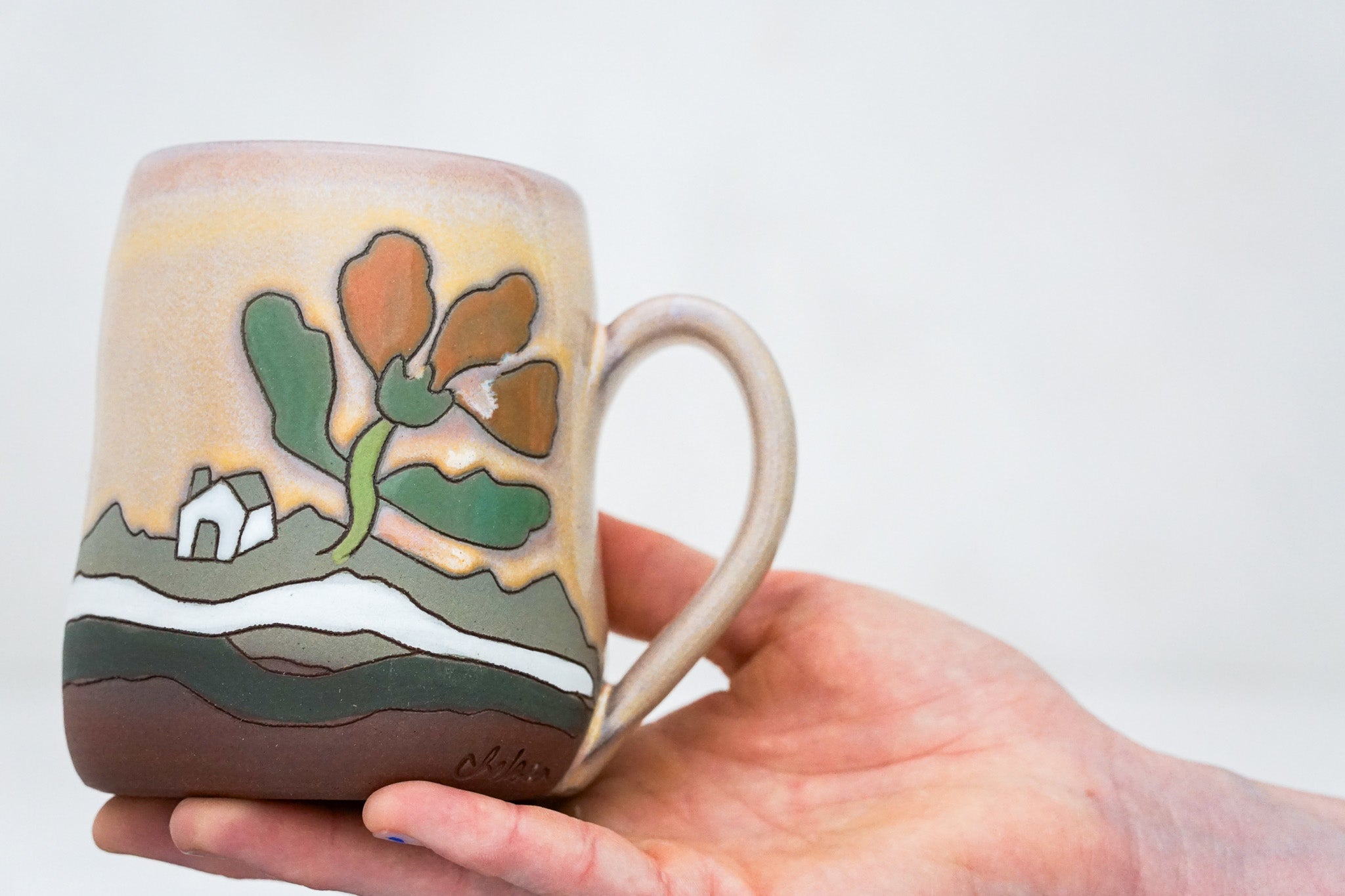 Wavy Cabin in the Flowers mug in Alpenglow*