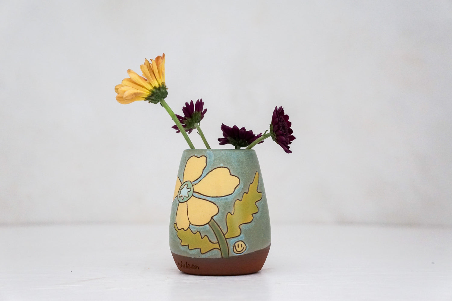 Yellow Flower vase in Lake