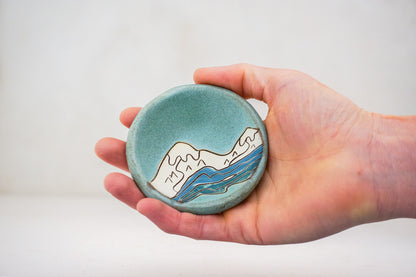 Snow caps ring dish in Lake