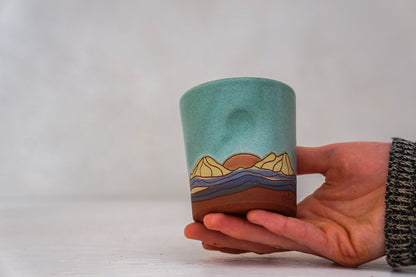 Orange Sunrise Mountain cup In Lake