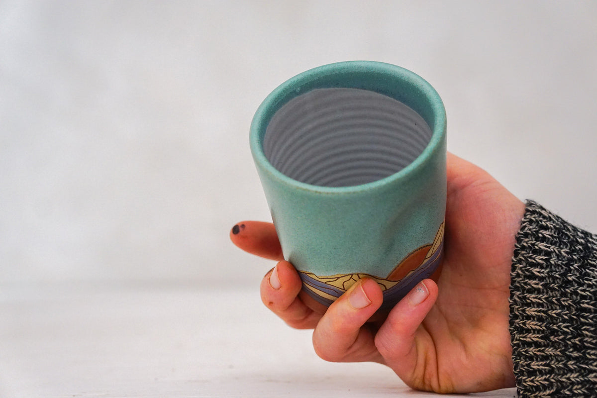Orange Sunrise Mountain cup In Lake