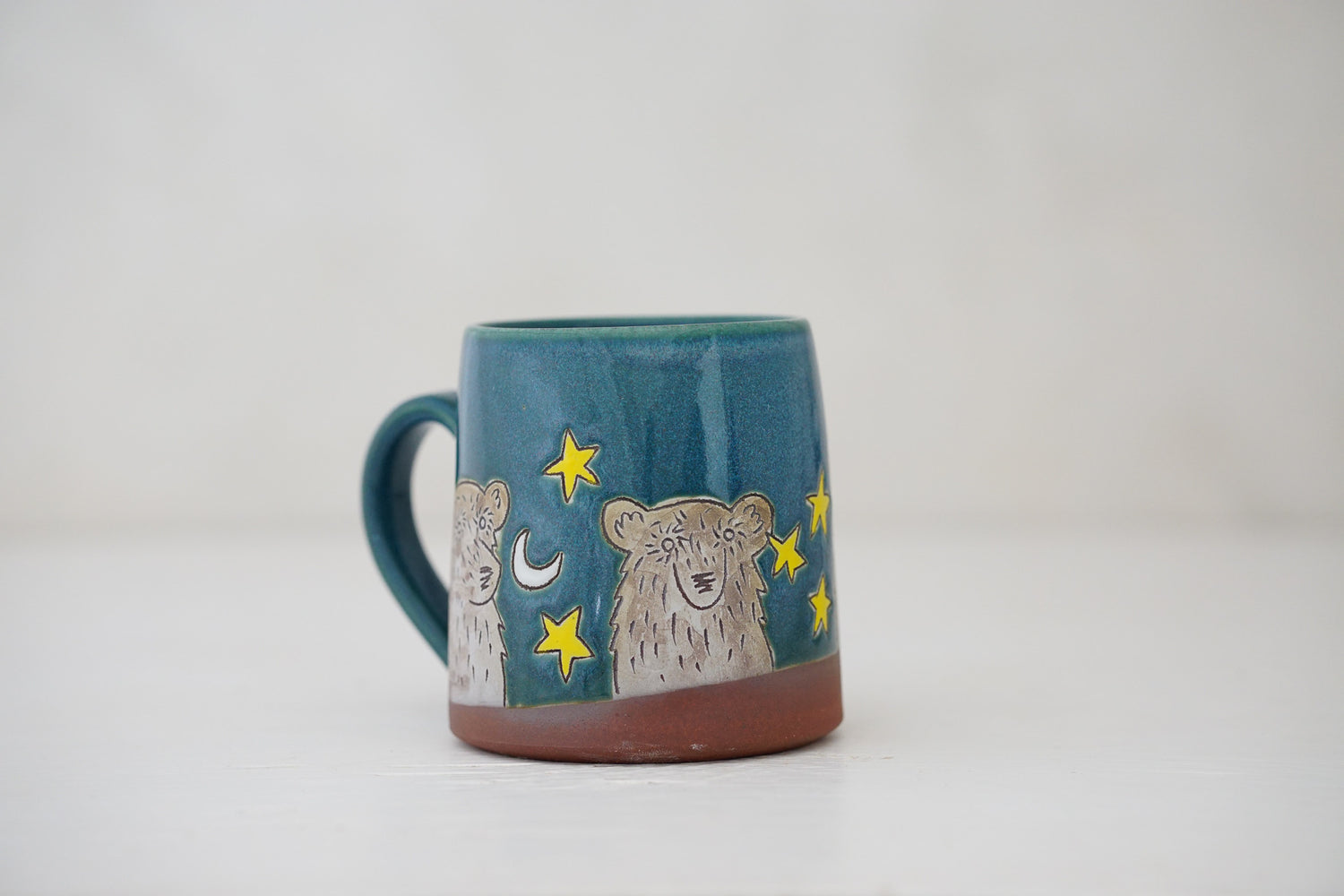 Bear moon stars mug in Huckleberry