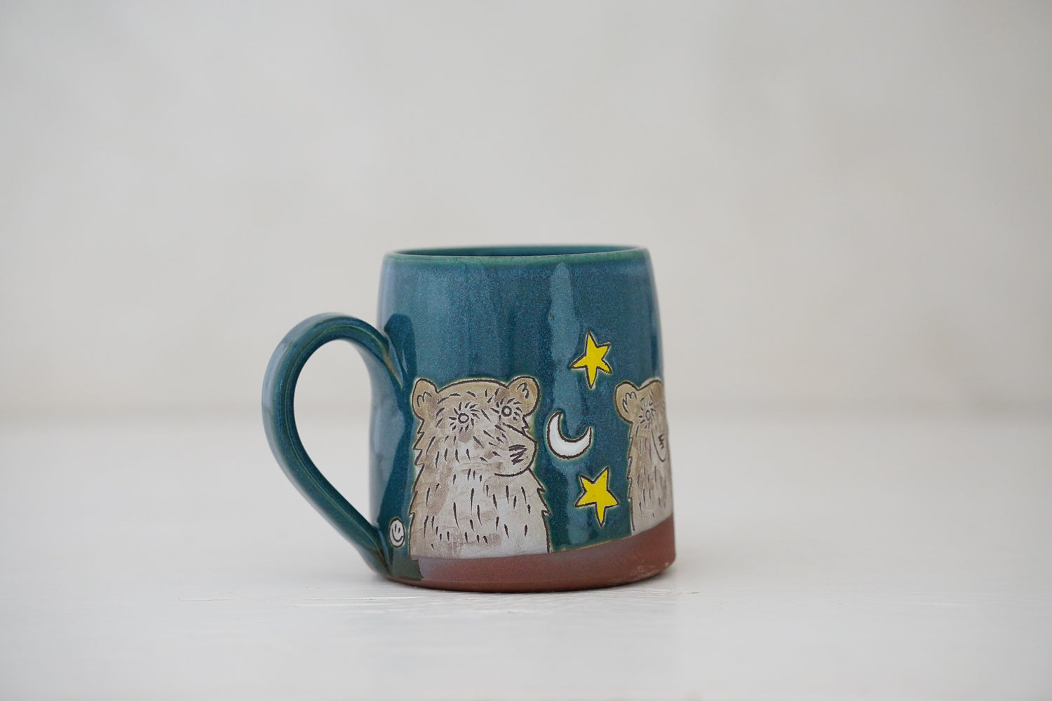 Bear moon stars mug in Huckleberry