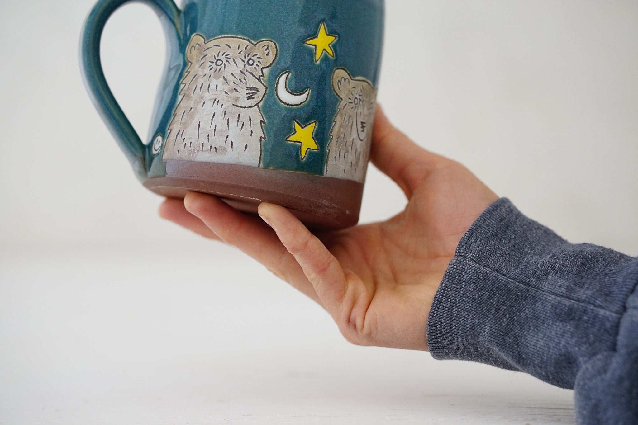 Bear moon stars mug in Huckleberry