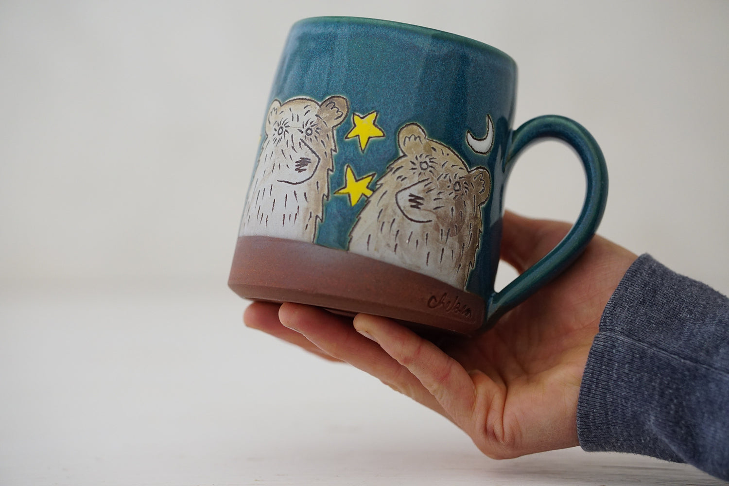 Bear moon stars mug in Huckleberry