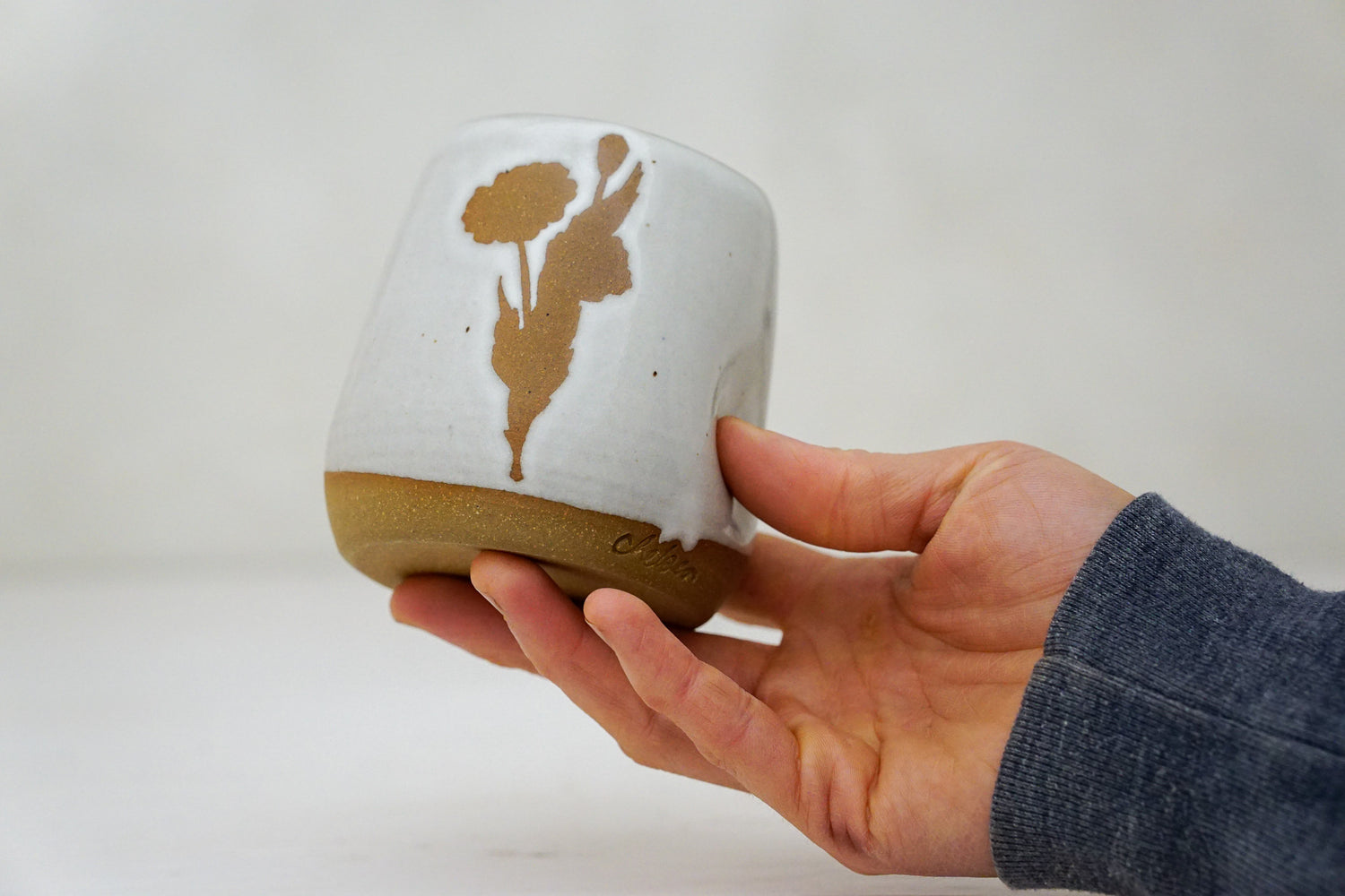 Brown clay Poppy Cup in White 2