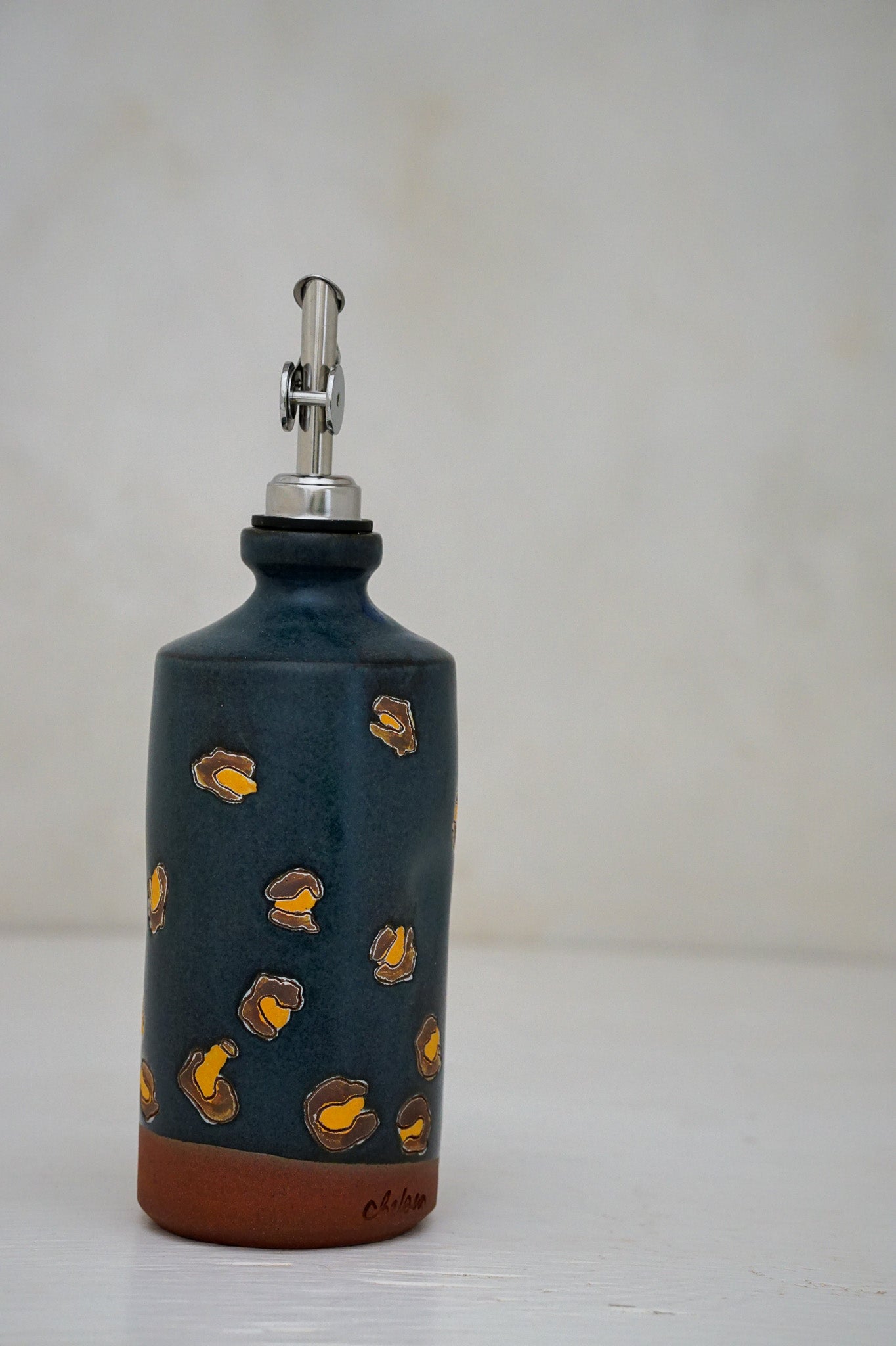 Cheetah print olive oil bottle in Darby
