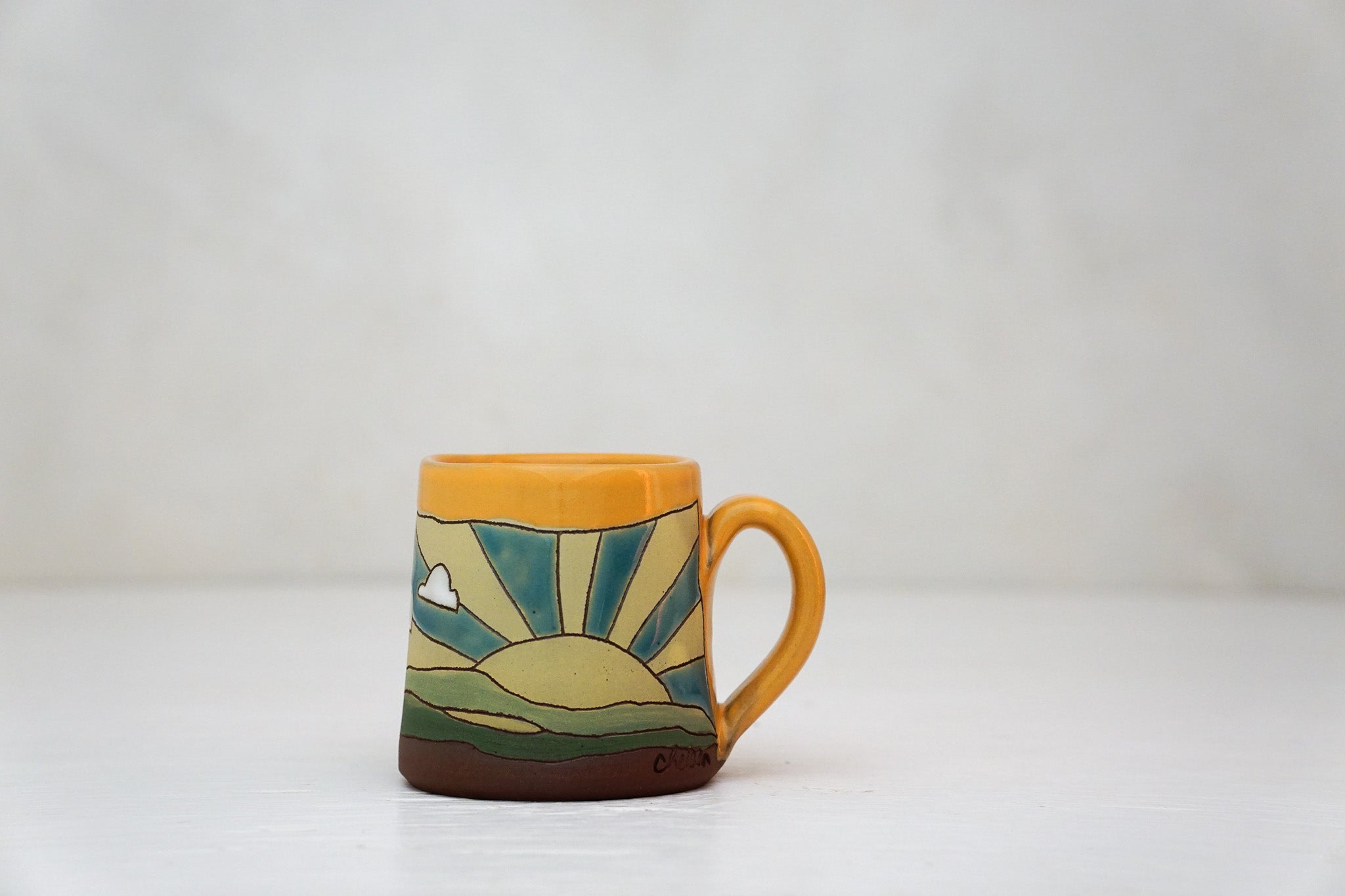 Sunburst Tiny mug in TangX