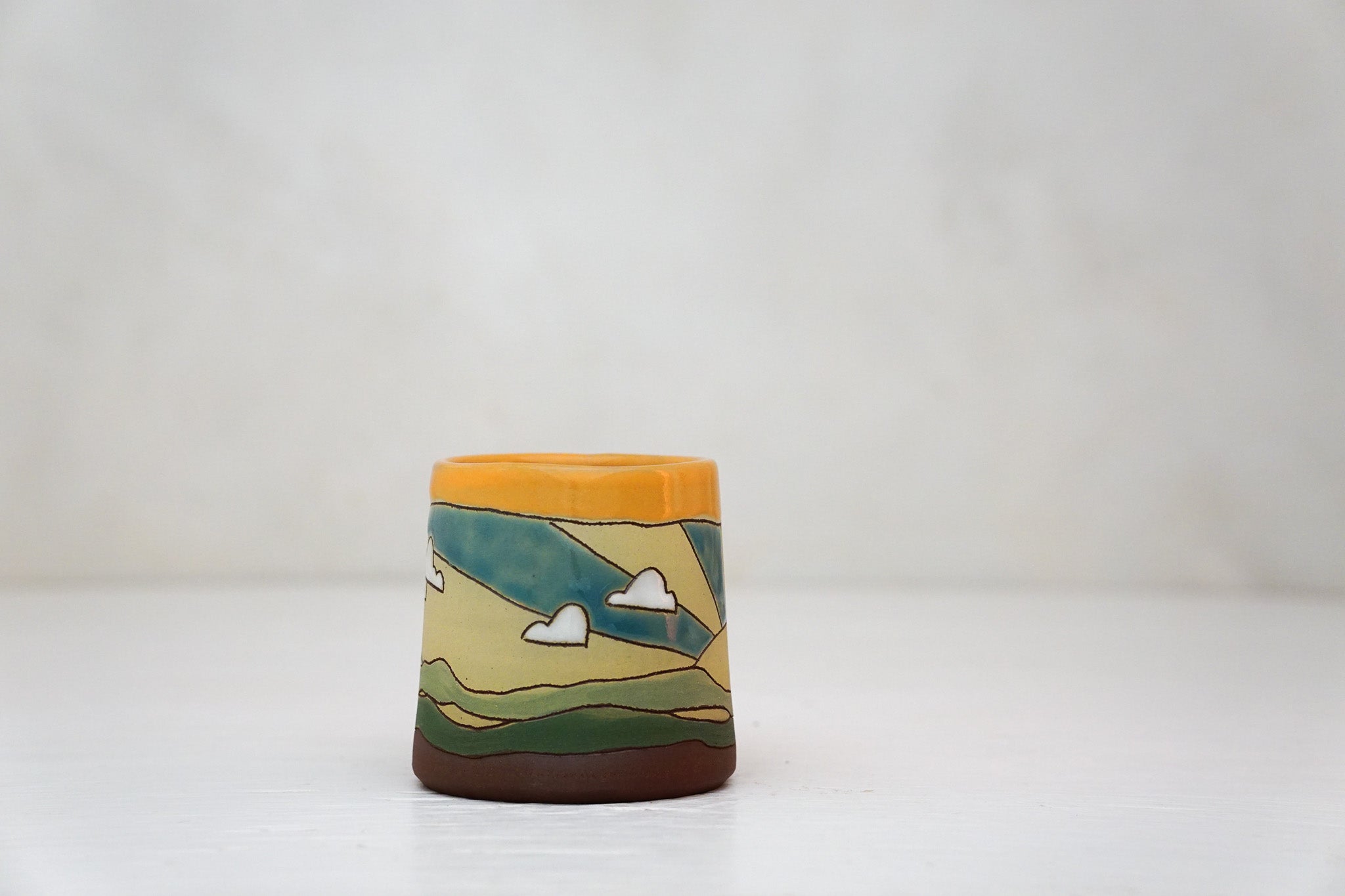 Sunburst Tiny mug in TangX