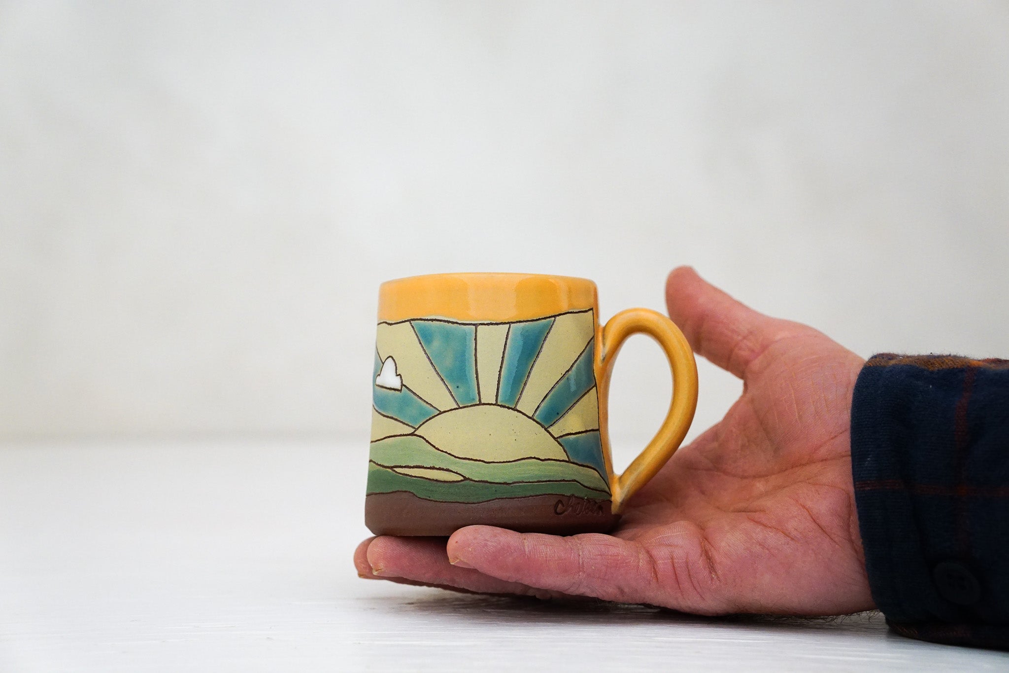 Sunburst Tiny mug in TangX