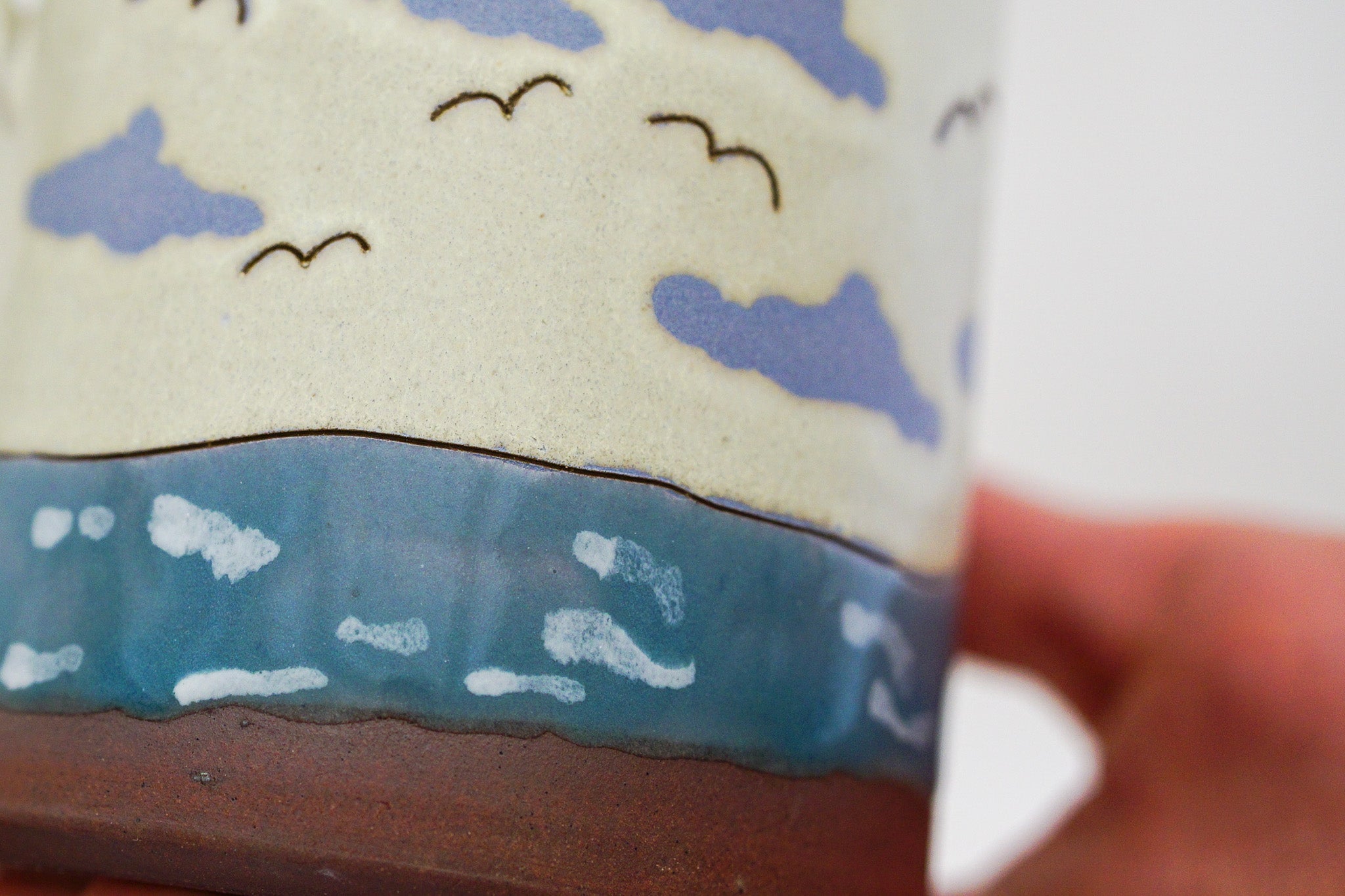 Waves roll in mug in Bone