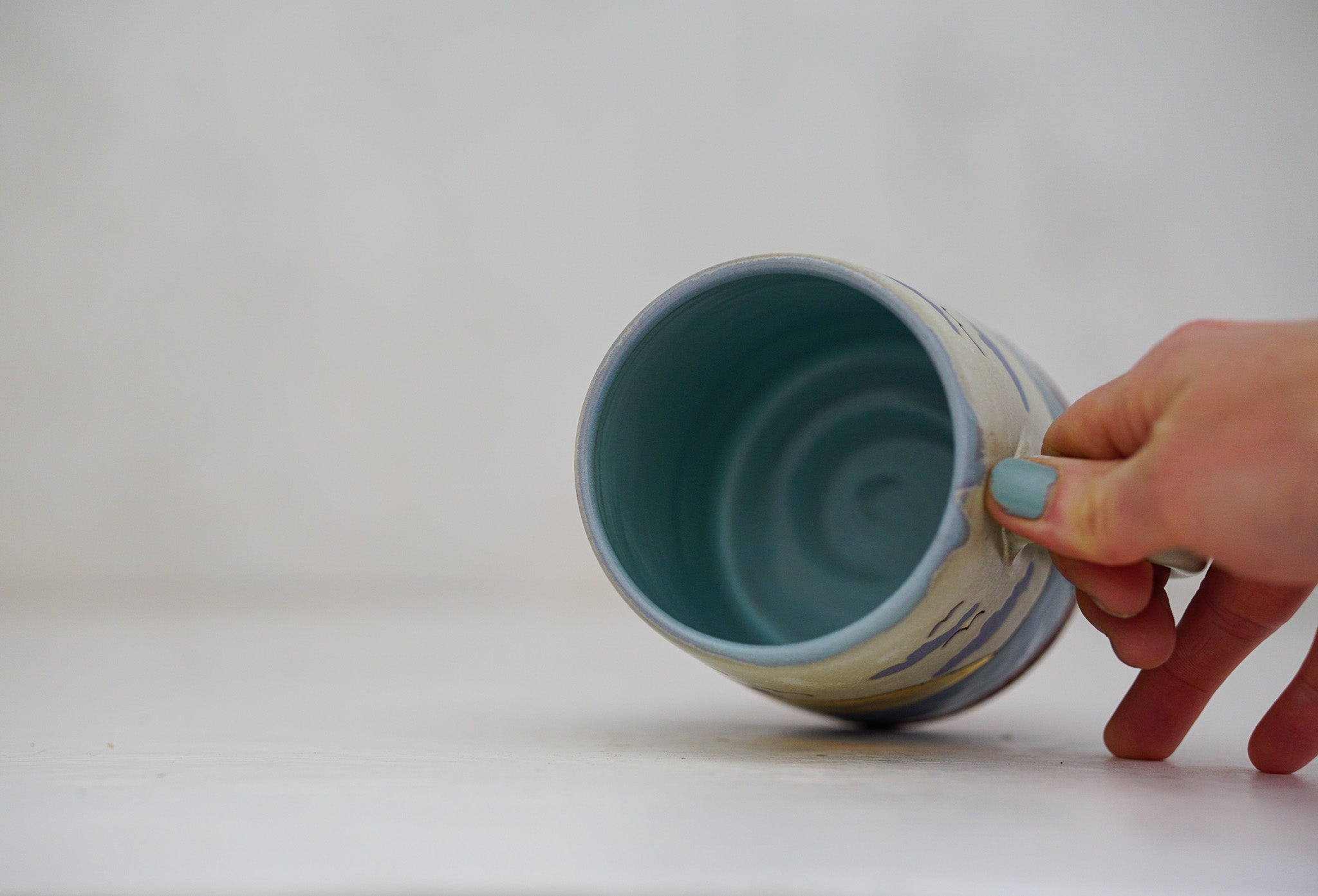 Waves roll in mug in Bone