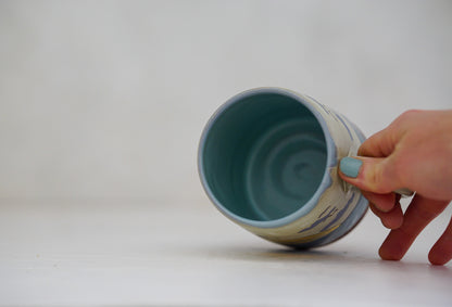 Waves roll in mug in Bone