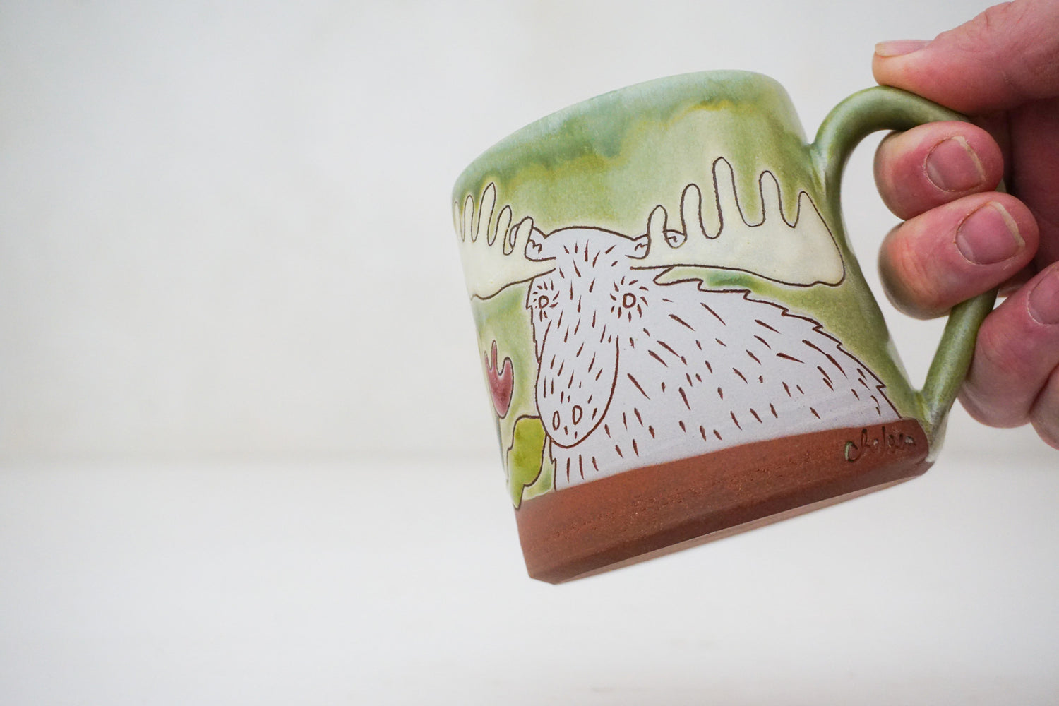 Moose smelling Flowers mug in Sage