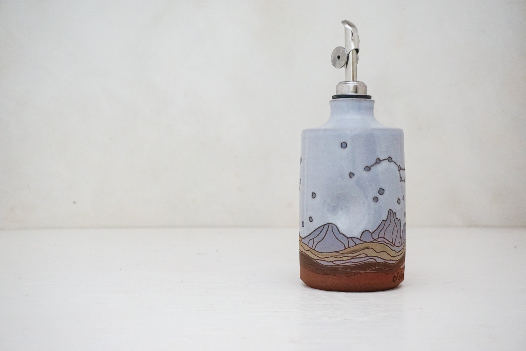 E Teton dipper Olive Oil pour