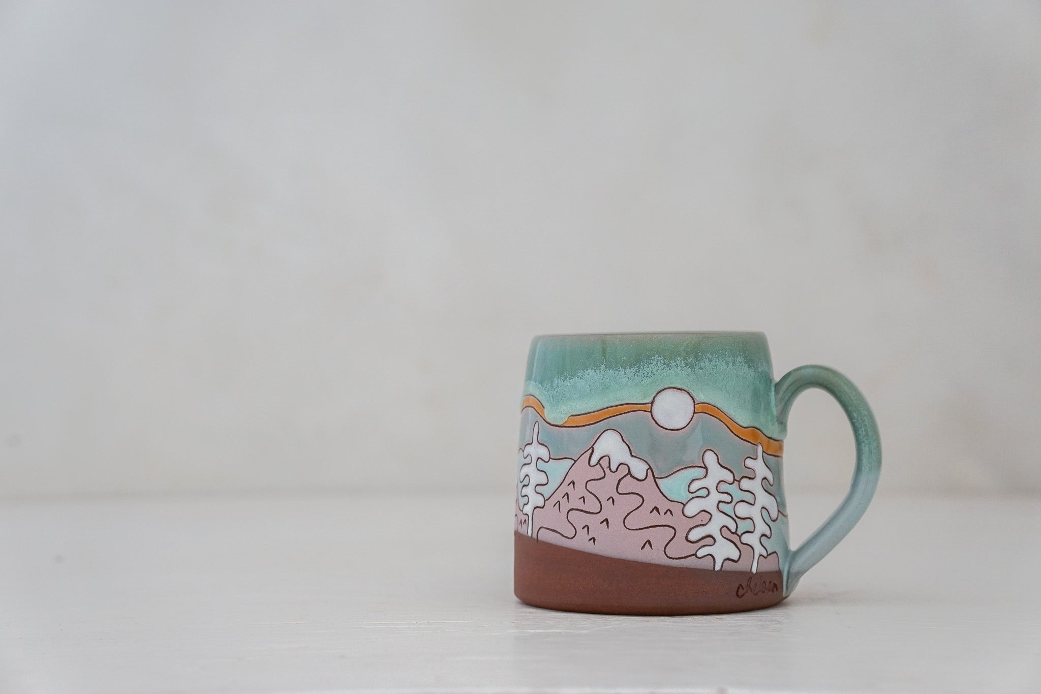 Mtn tree Skylines mug in Ira Blue*