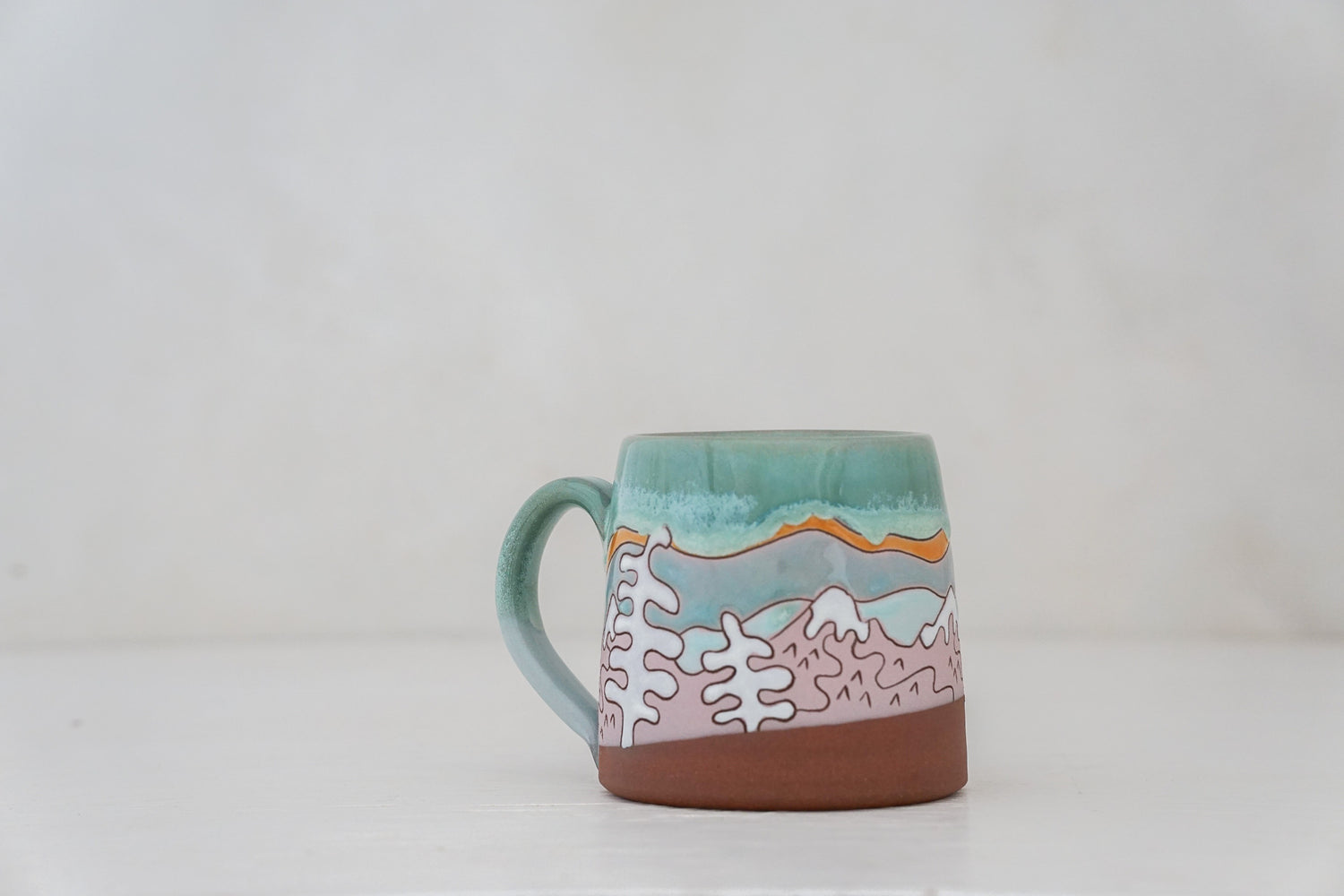 Mtn tree Skylines mug in Ira Blue*