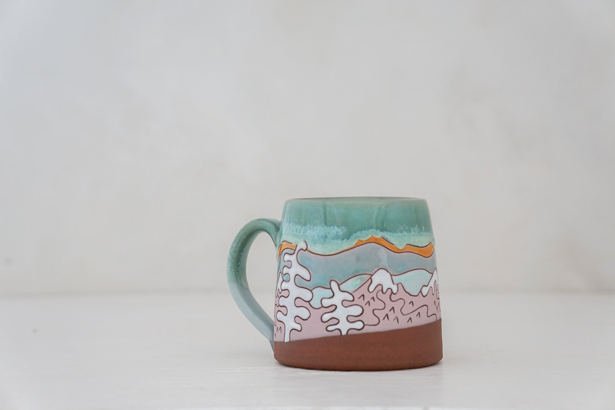 Mtn tree Skylines mug in Ira Blue*