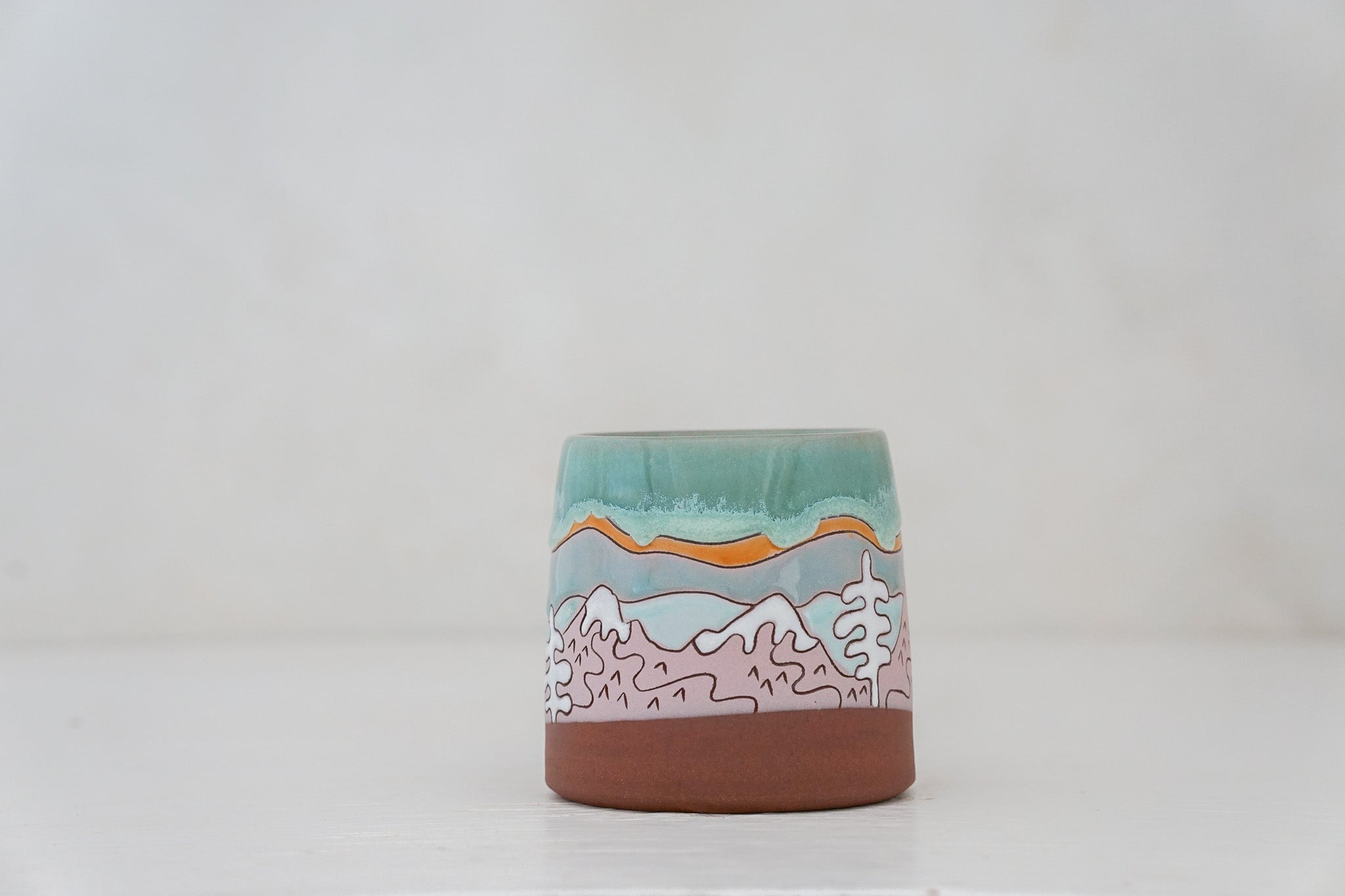 Mtn tree Skylines mug in Ira Blue*