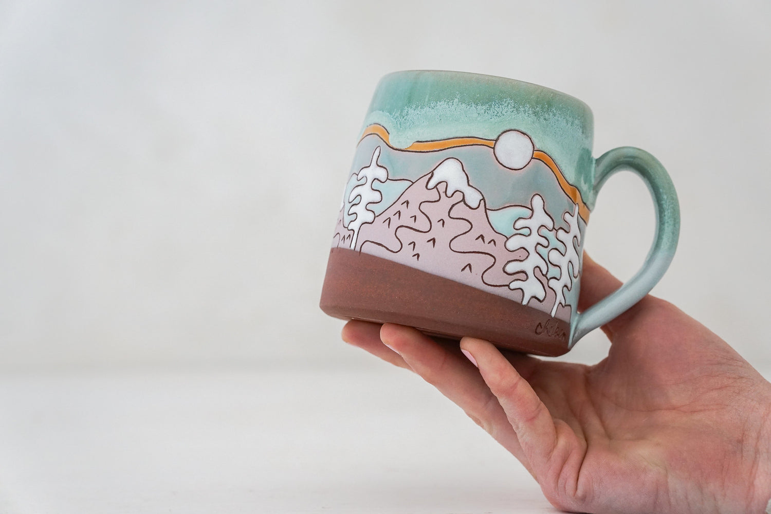 Mtn tree Skylines mug in Ira Blue*