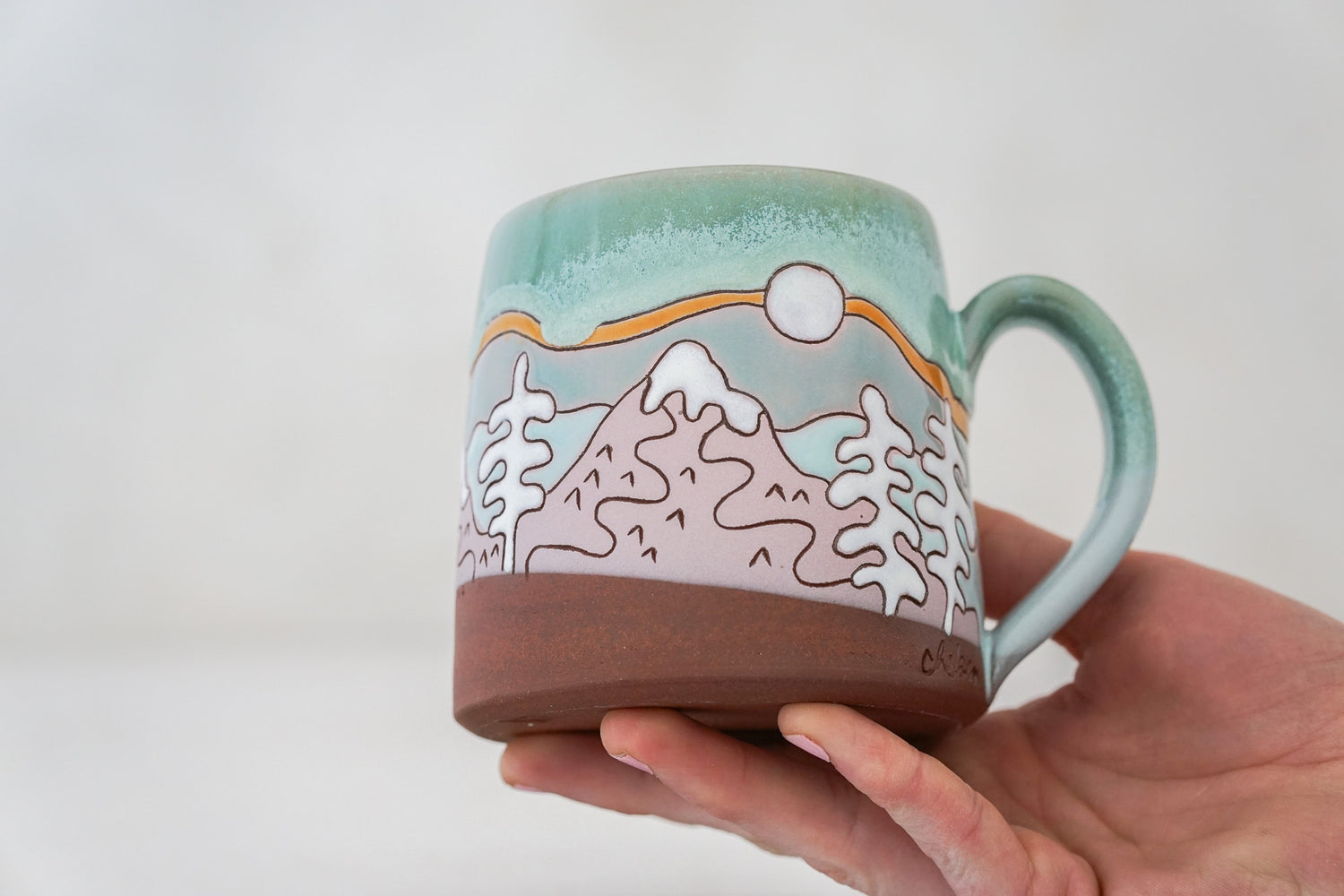 Mtn tree Skylines mug in Ira Blue*