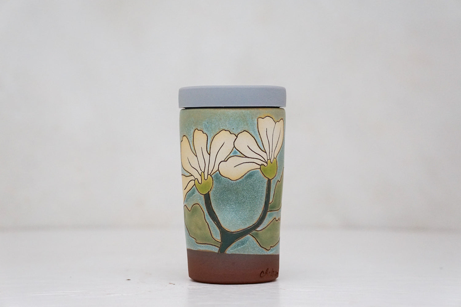 Flowers have poweres travel cup in Lake