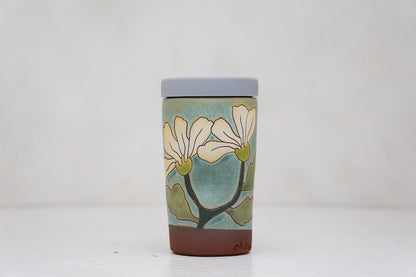 Flowers have poweres travel cup in Lake
